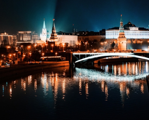 Russian - Moscow bridge with lighted buildings in the background