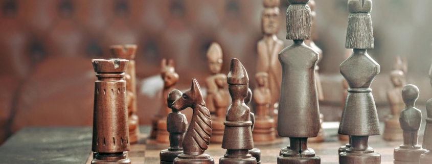 Game of strategy: chess pieces on the table